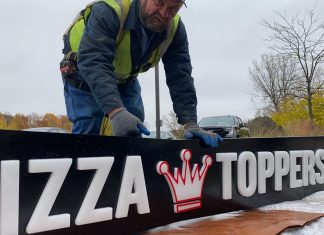 Facade sign at Toppers Pizza